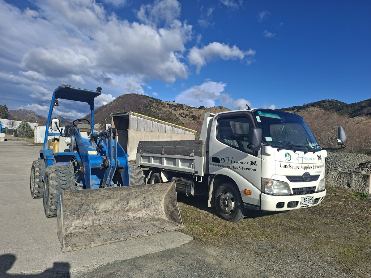 The Hanmer Landscape Supplies tip truck and loader